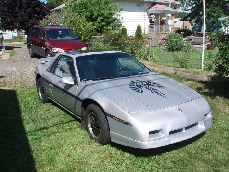 Silver sports car on grass