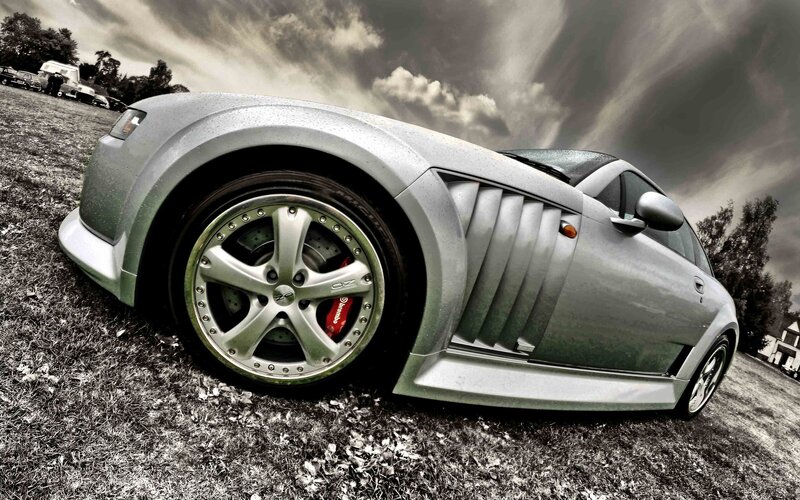 silver sports car on grass