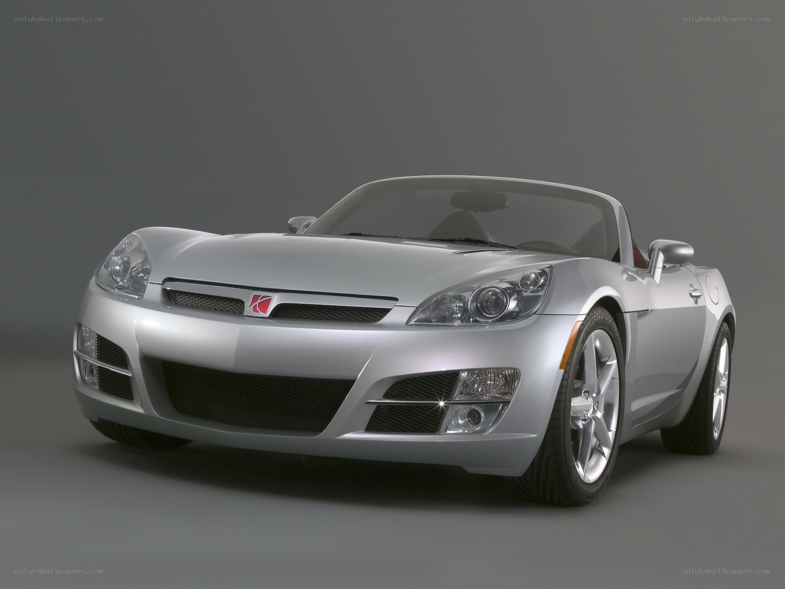 Silver sports car on gray background