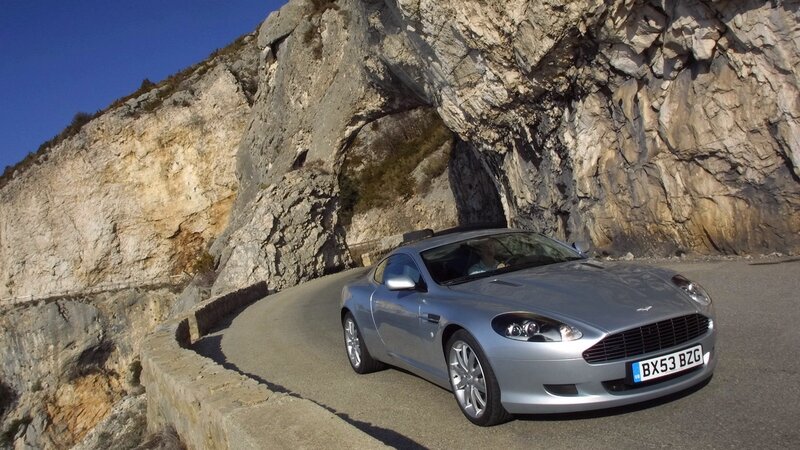 silver sports car on mountain road
