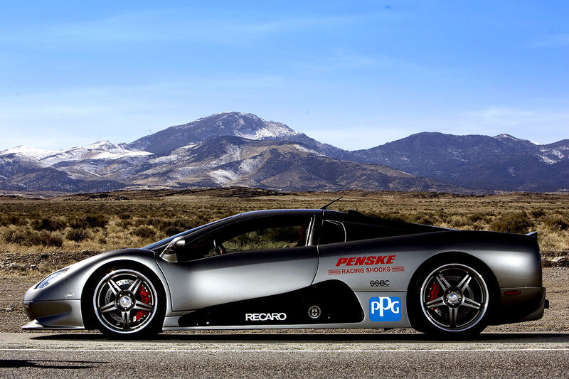 Silver sports car on mountain road