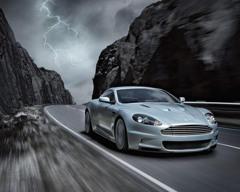 Silver sports car on mountain road
