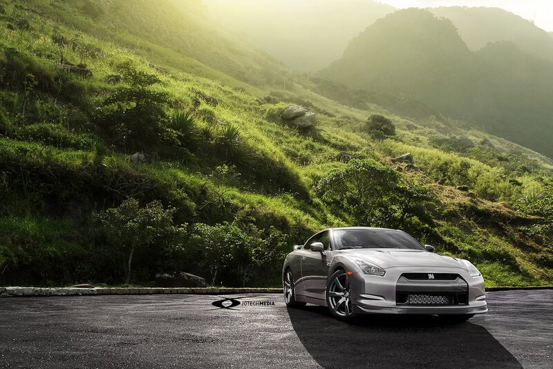 Silver sports car on mountain road