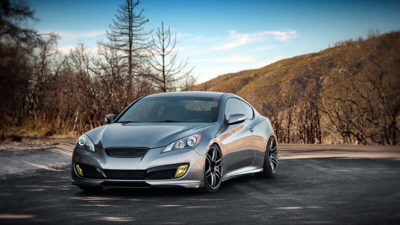 silver sports car on mountain road
