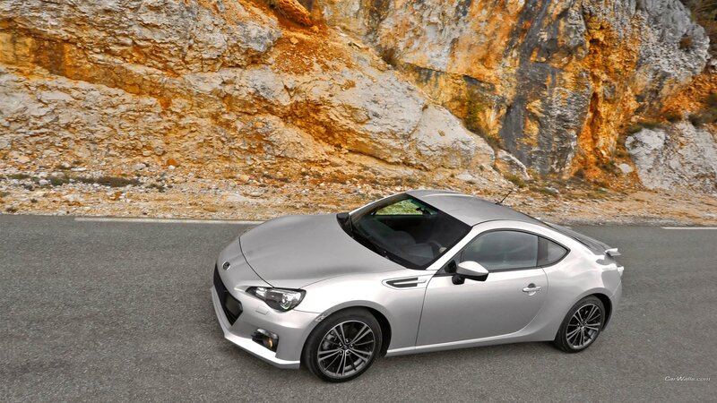 silver sports car on mountain road