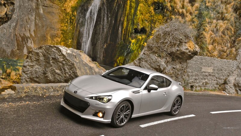 Silver sports car on mountain road