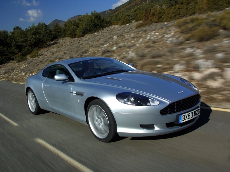 silver sports car on mountain road