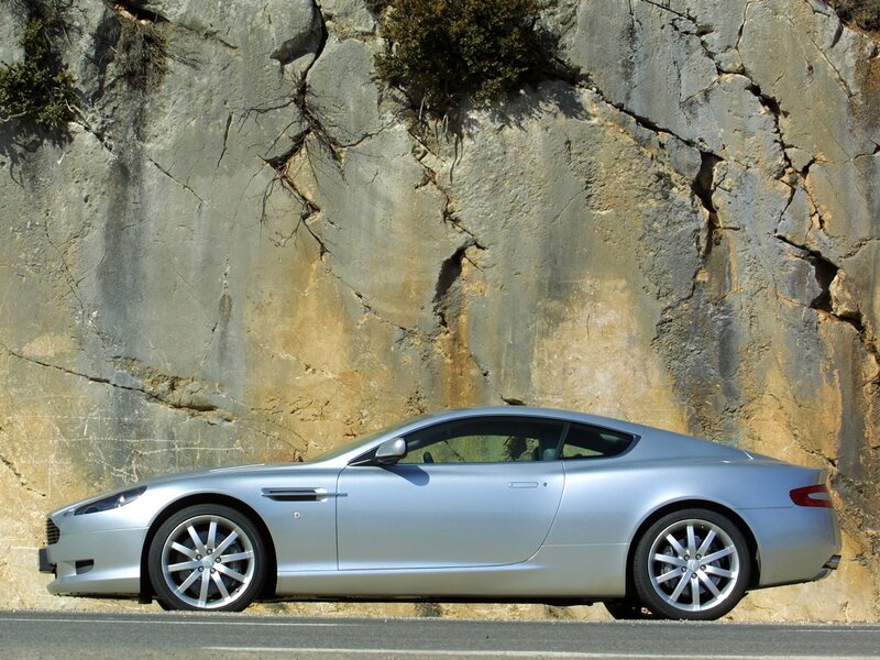 silver sports car on mountain road
