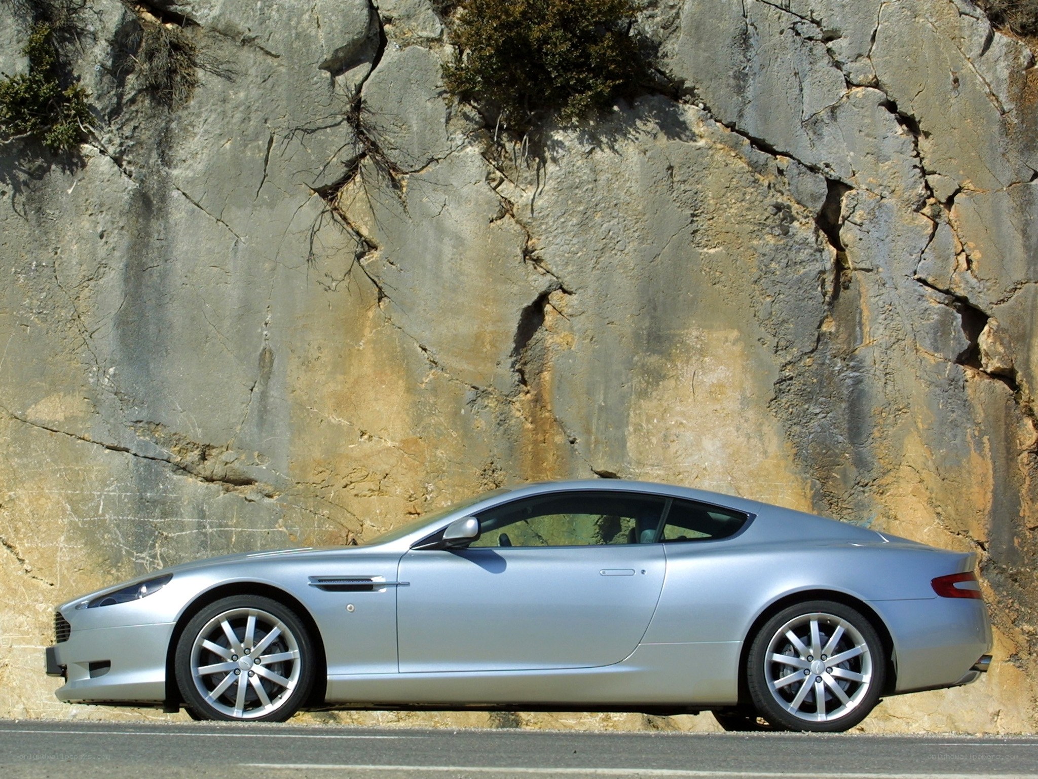 silver sports car on mountain road
