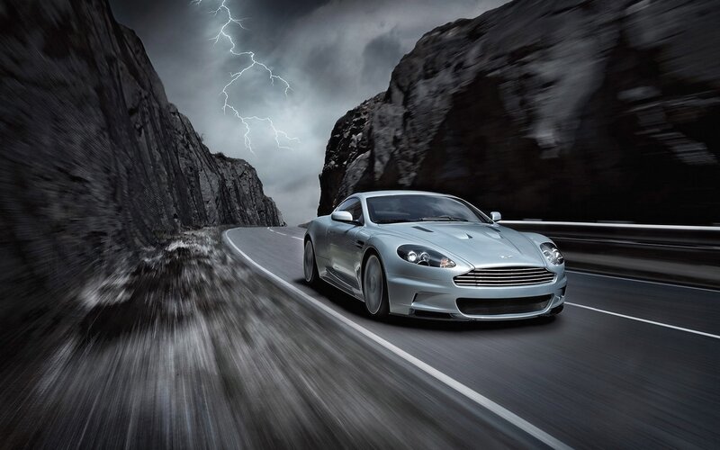 Silver sports car on mountain road