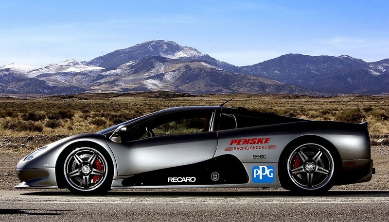 silver sports car on mountain road