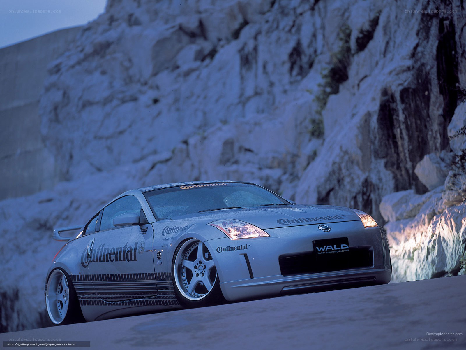 silver sports car on mountain road