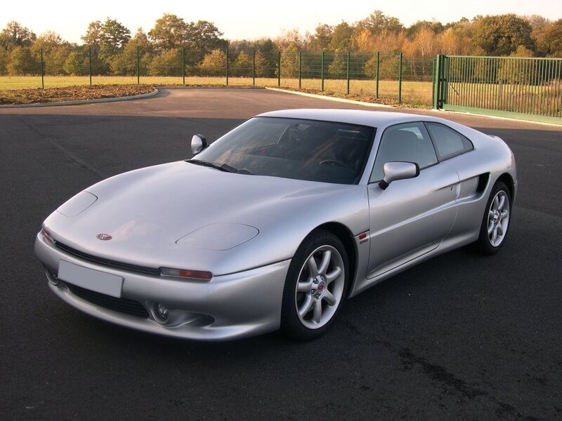 silver sports car on pavement
