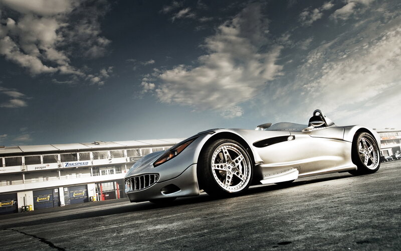 silver sports car on racetrack