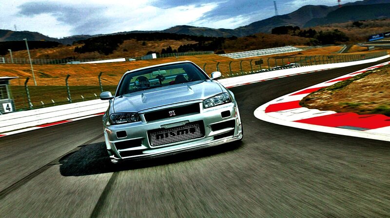 silver sports car on racetrack
