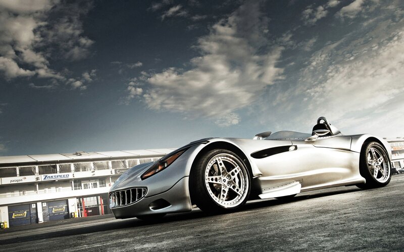 silver sports car on racetrack