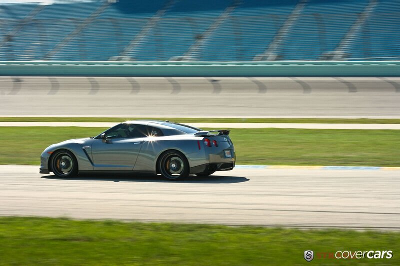 silver sports car on racetrack