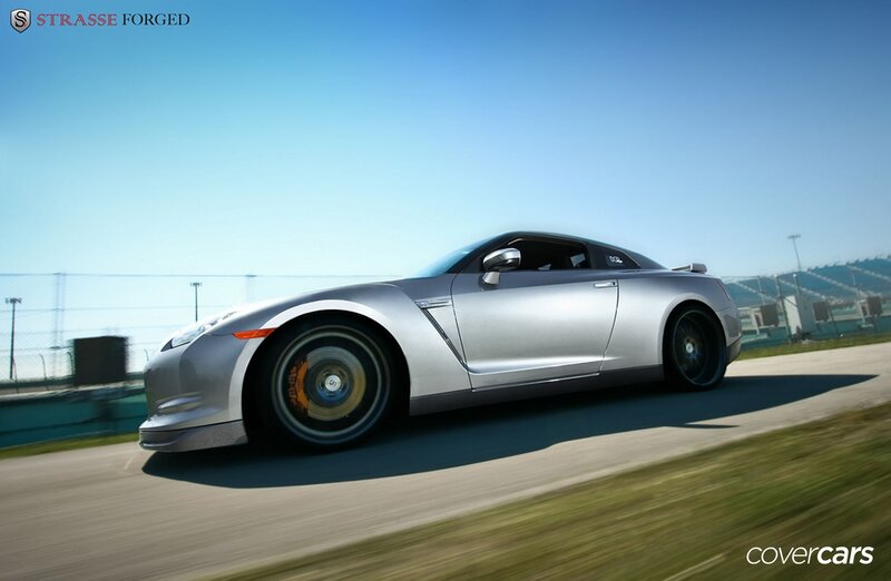 silver sports car on racetrack