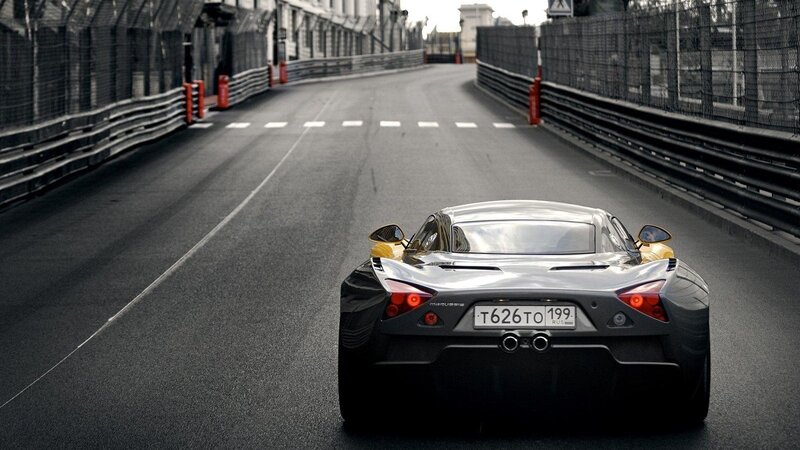 silver sports car on racetrack