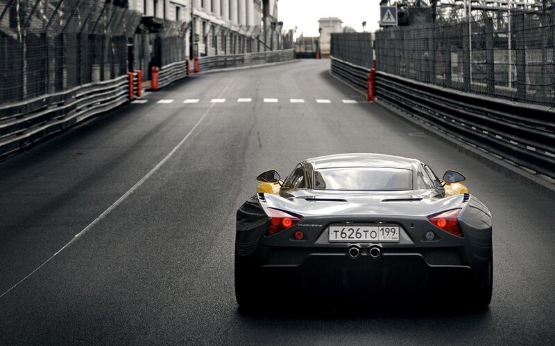 silver sports car on racetrack