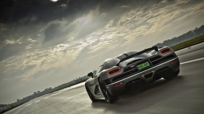 silver sports car on racetrack