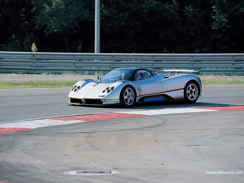 silver sports car on racetrack