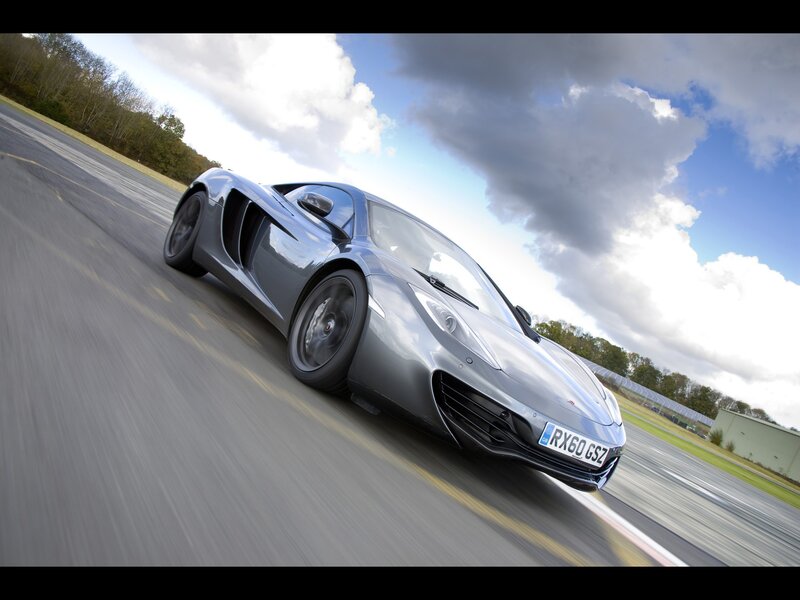 silver sports car on racetrack
