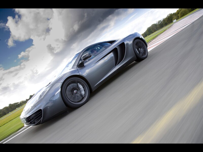 silver sports car on racetrack