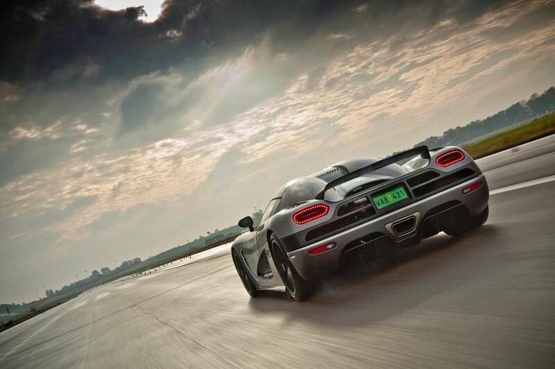 silver sports car on racetrack