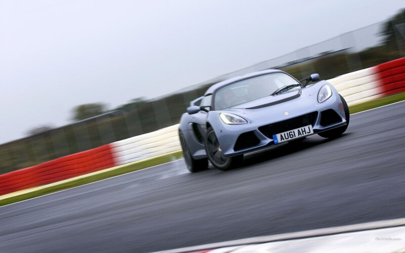silver sports car on racetrack