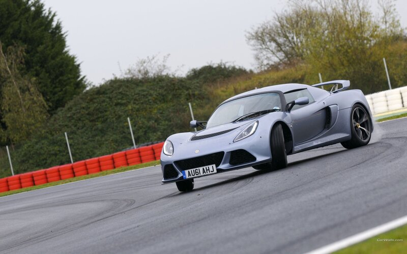 silver sports car on racetrack