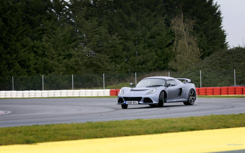 silver sports car on racetrack
