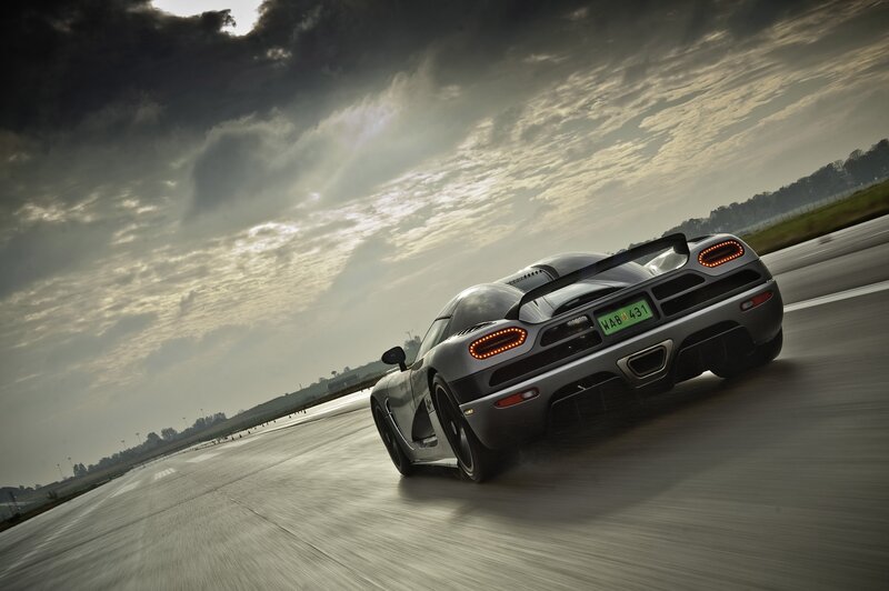 silver sports car on racetrack