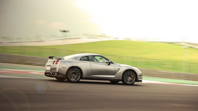 silver sports car on racetrack