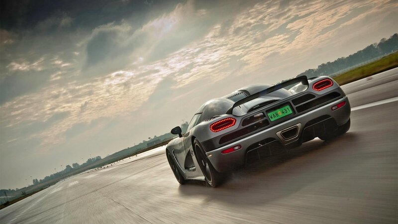 silver sports car on racetrack