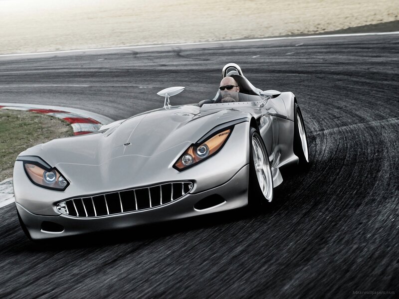 silver sports car on racetrack