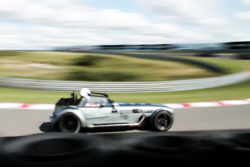 Silver sports car on racetrack