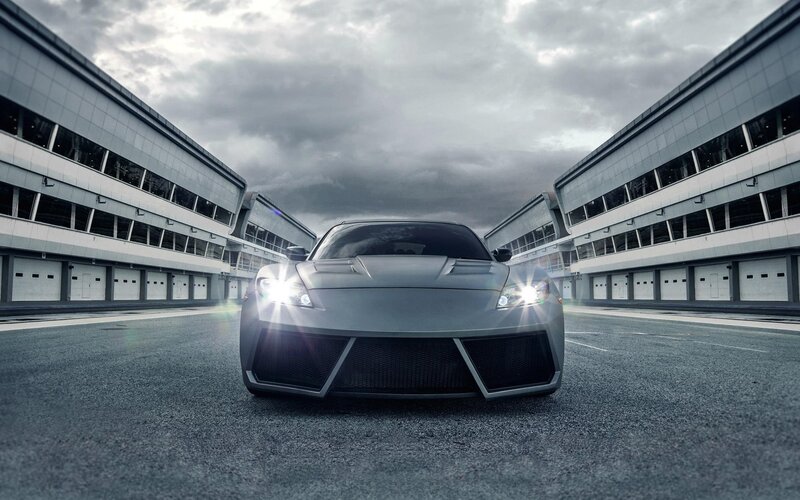 silver sports car on racetrack