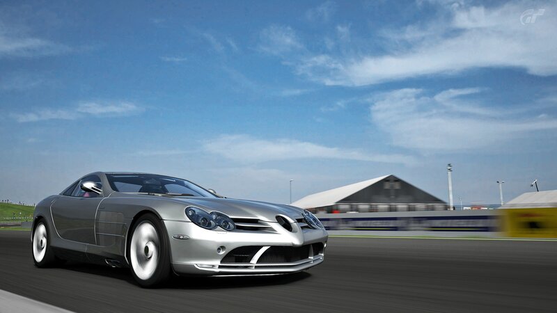 silver sports car on racetrack