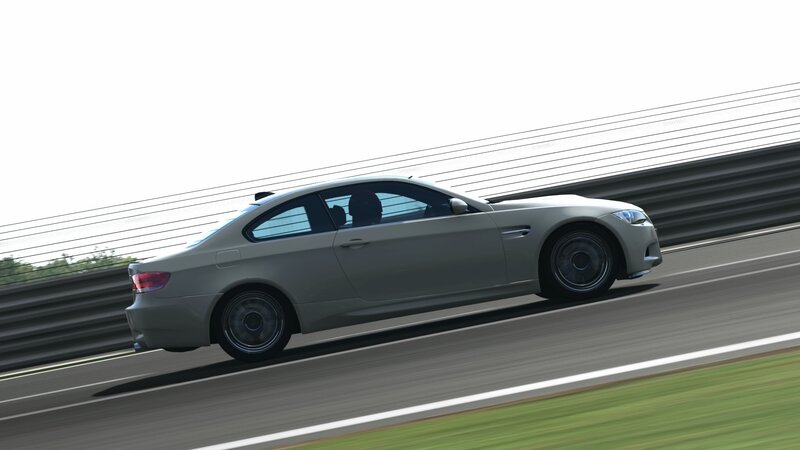 silver sports car on racetrack