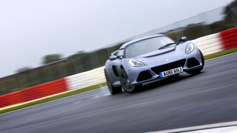 silver sports car on racetrack