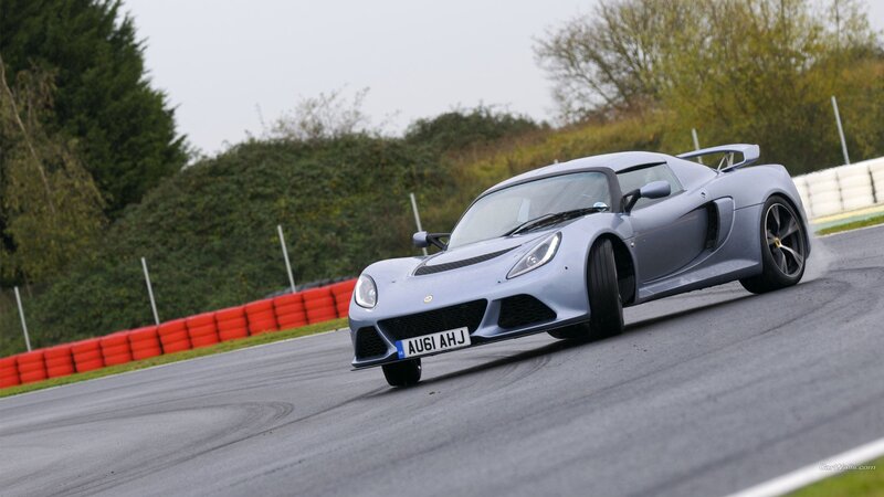 silver sports car on racetrack