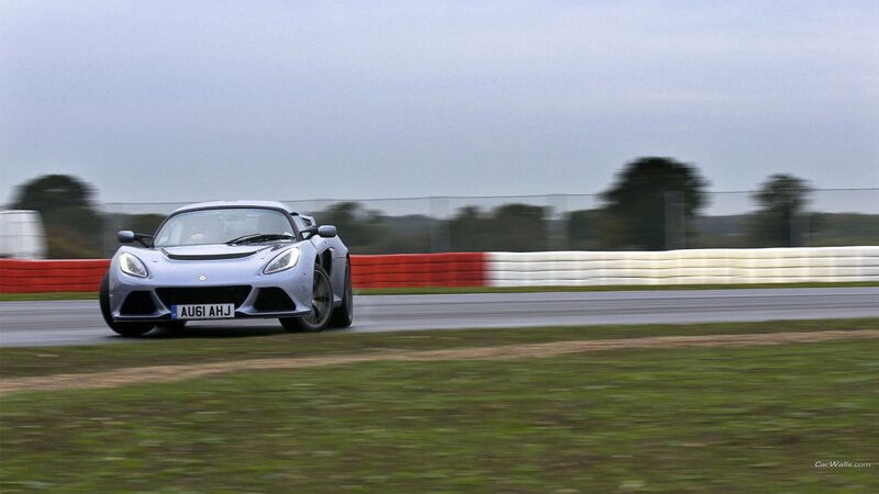silver sports car on racetrack