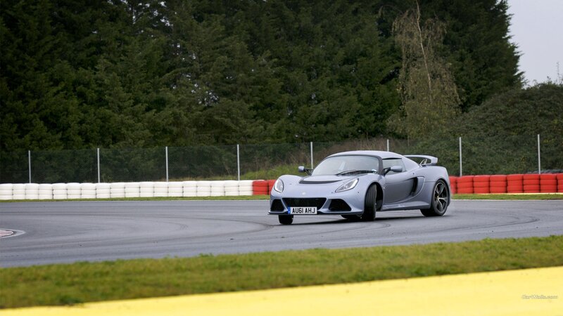 silver sports car on racetrack