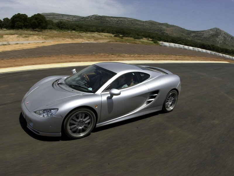 silver sports car on racetrack