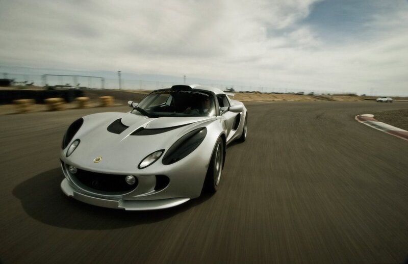 silver sports car on racetrack