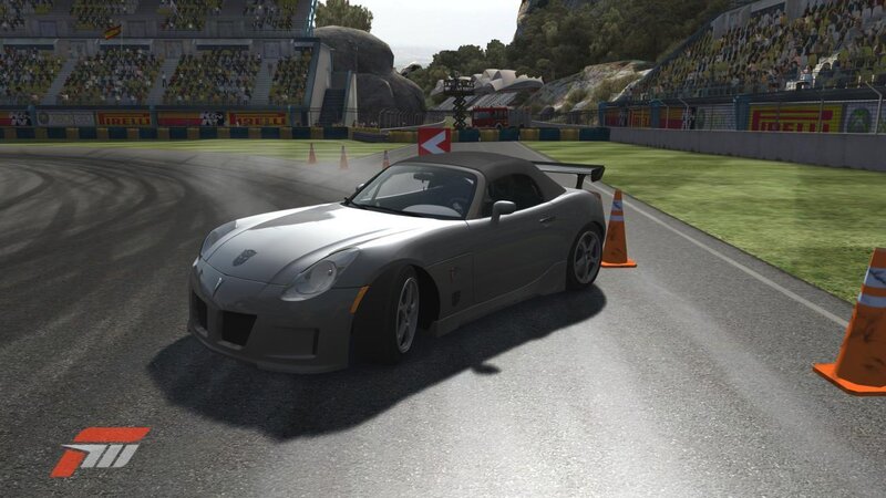 Silver sports car on racetrack