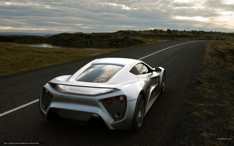 Silver Sports Car on Road — Dramatic