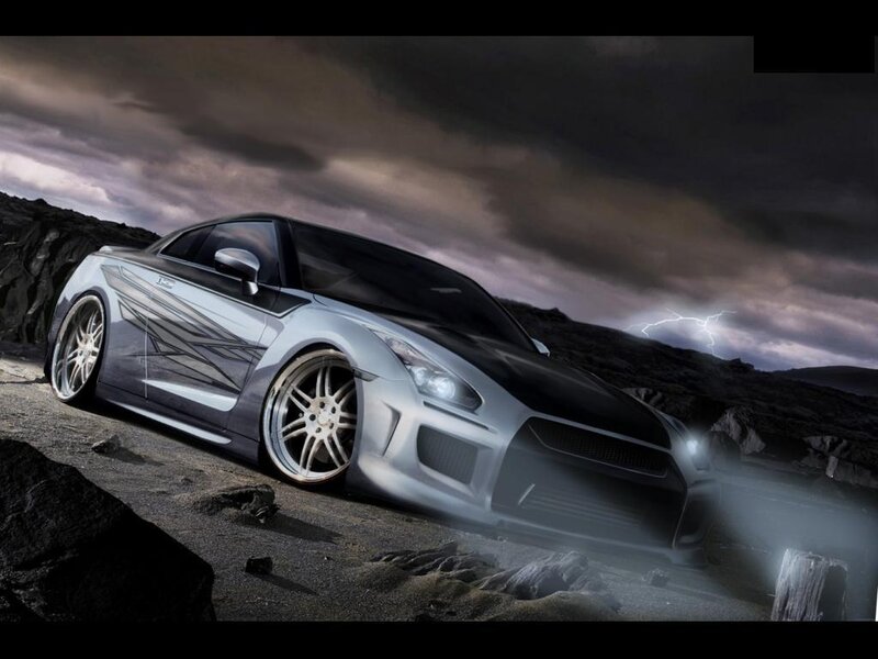 Silver sports car on rocky terrain
