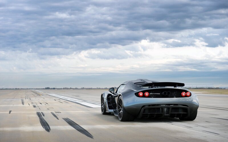 silver sports car on runway